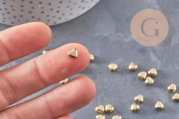 Gold-tone plastic domed heart beads, 5.5mm, x 10g VALID