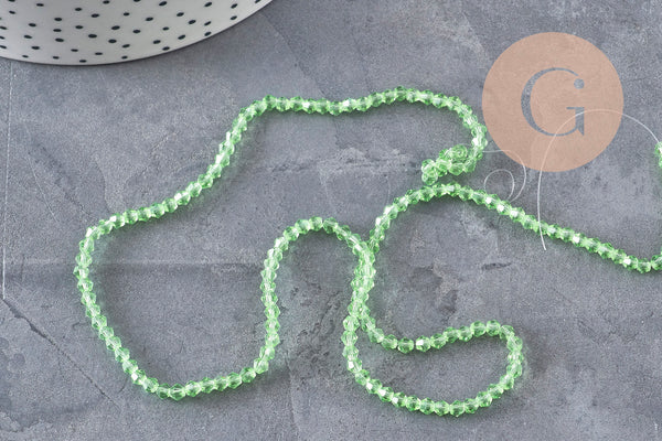 Perles cristal toupies à facette vert transparent 3-3.3mm, x1 fil de 38cm (G11111)