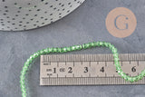 Perles cristal toupies à facette vert transparent 3-3.3mm, x1 fil de 38cm (G11111)