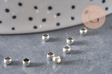 Perlas de aplastar de latón platino 3x2mm, x2 gramos VÁLIDO