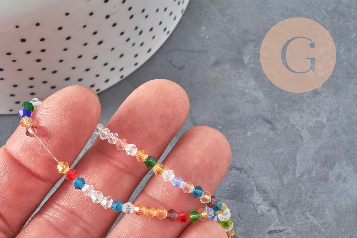 Perles toupies cristal à facette multicolore 3.8x3mm, x1 fil de 32.5cm (G11344)
