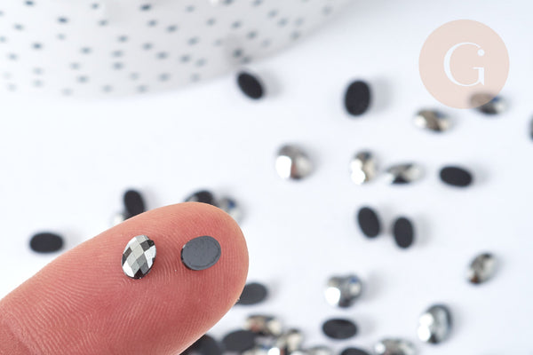 Cabochon strass plastique noir irisé ovale 6x4mm, x 5 grammes (G8339)