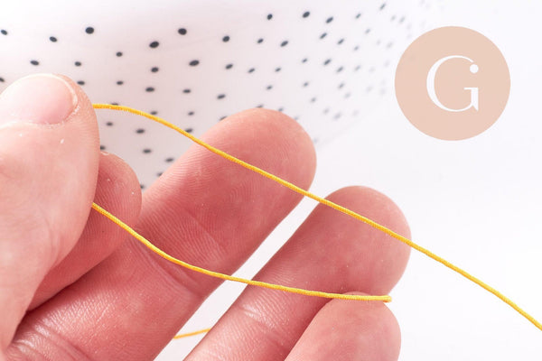 Cordon Jaune doré tressé polyester 0.6mm, x1 mètre (G10664)