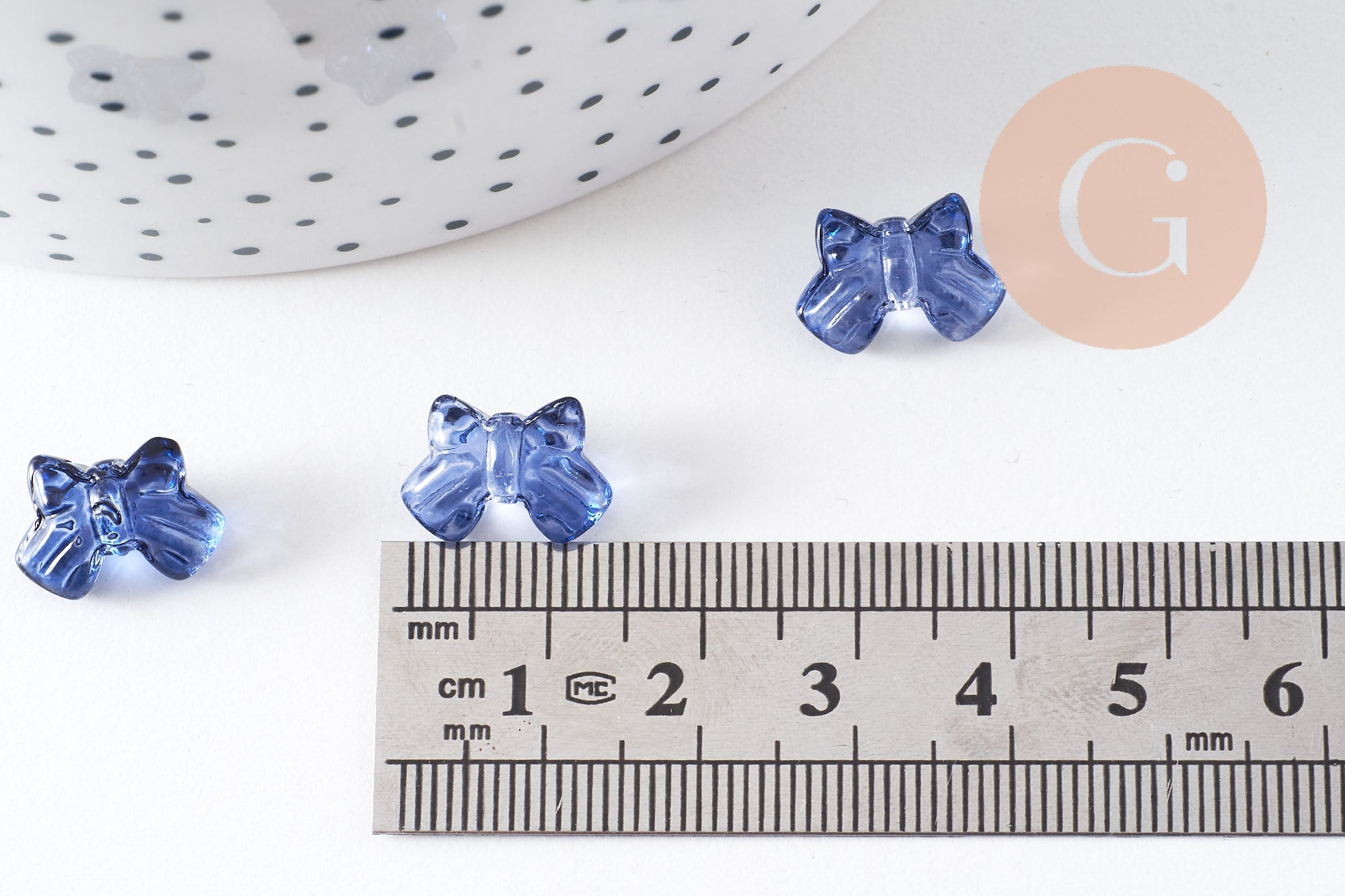 Perle noeud papillon verre bleu transparent irisé 9.5mm, x10 (G10597)