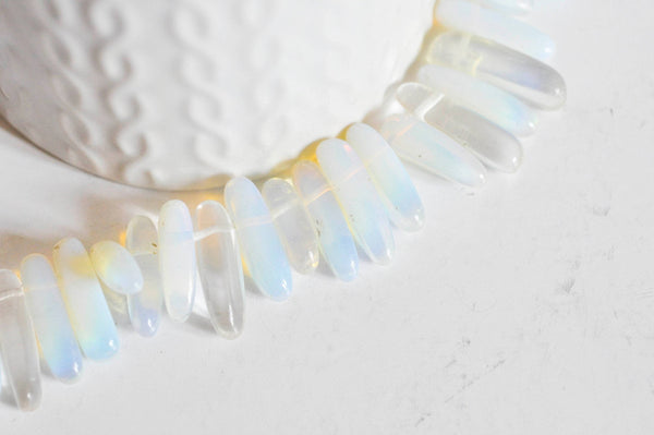Perle ovale opalite roulée synthèse 13-22mm, x1 fil (G1476)
