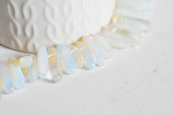 Perle ovale opalite roulée synthèse 13-22mm, x1 fil (G1476)