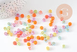 Perle ronde Symboles plastique multicolore pastel doré, x10 grammes (G10557)