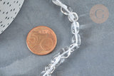 Natural rock crystal beads, oval-shaped, next to a 5-cent euro coin on a dark surface, part of a 40cm strand for DIY jewelry (G2050).