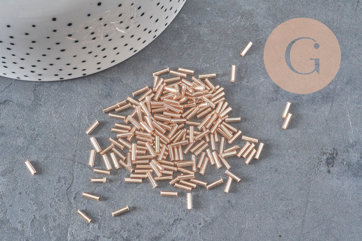 Cuentas de rocalla en tubo rosa champán metalizado 6-8mm x 1.6mm, x10gr (G2459)