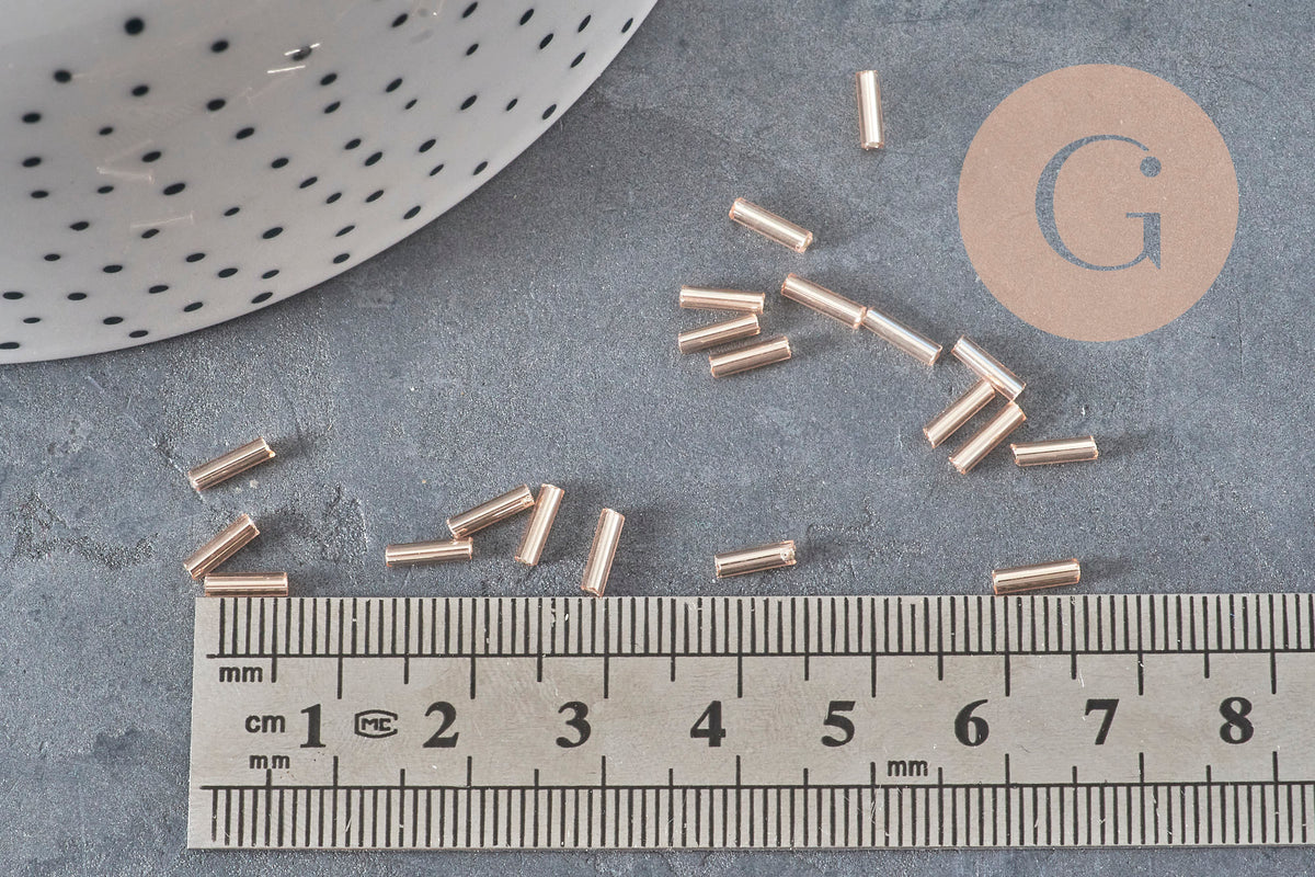 Cuentas de rocalla en tubo rosa champán metalizado 6-8mm x 1.6mm, x10gr (G2459)