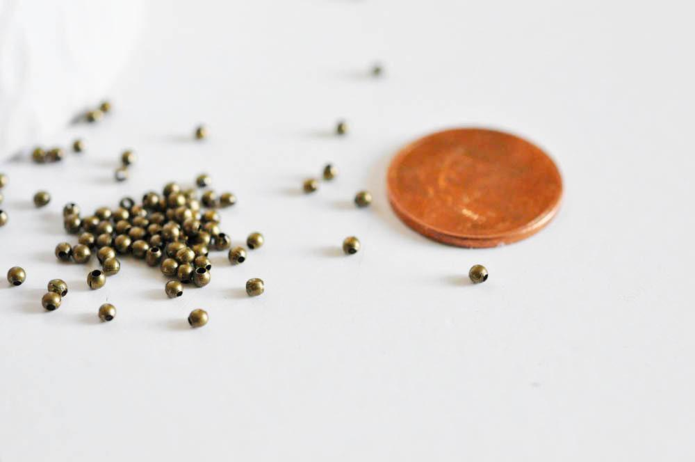 Perles rondes bronze intercalaires 2mm, x10 gr (G5147)