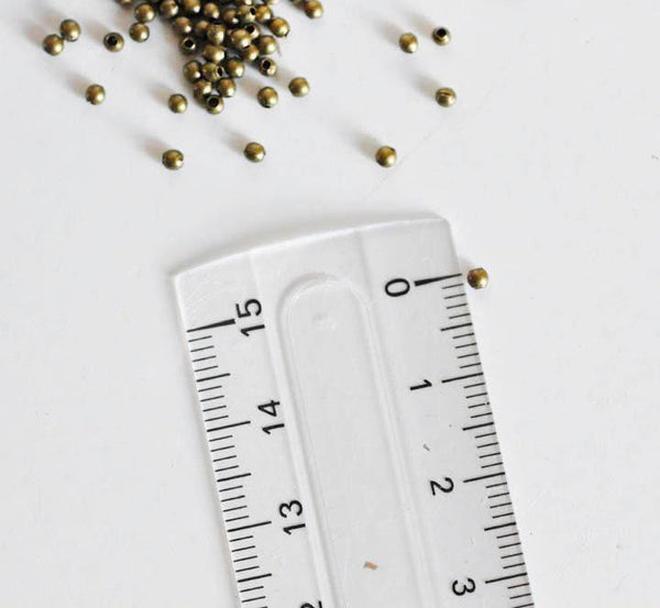 Perles rondes bronze intercalaires 2mm, x10 gr (G5147)