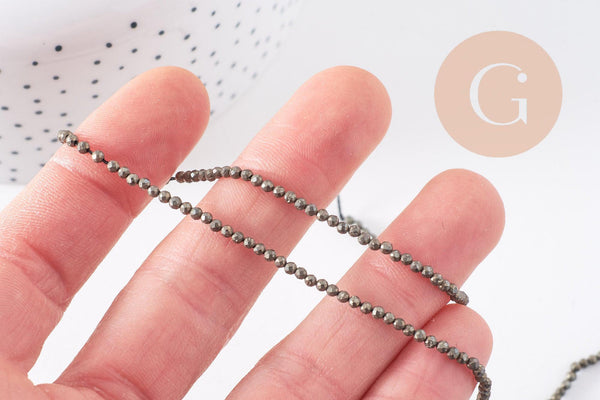 Perles rondes pyrite naturelle facettée 2mm, x1 fil de 40cm (G4046)