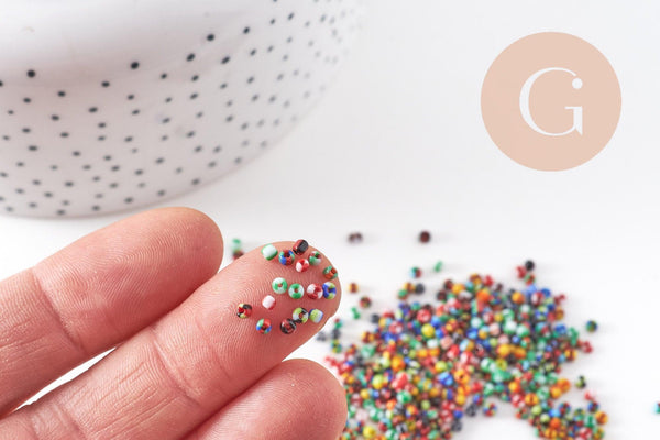 Petite Perle rocaille rayé multicolore 1.5x2mm x 10gr (G10934)