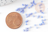 Petite perle rocaille rayé bleu blanc 1.5x2mm, x10 Gr (G9286)