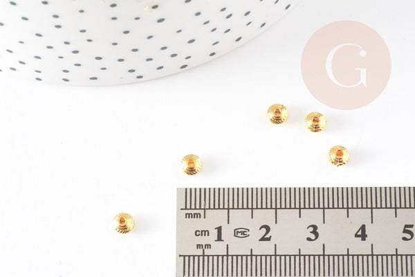 Perles intercalaires rondelles gravées zamac doré 6mm, x50 (8.10gr) (G0181)