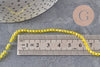 Perles cristal toupies à facette jaune transparent 3-3.3mm, x1 fil de 38cm (G11110)