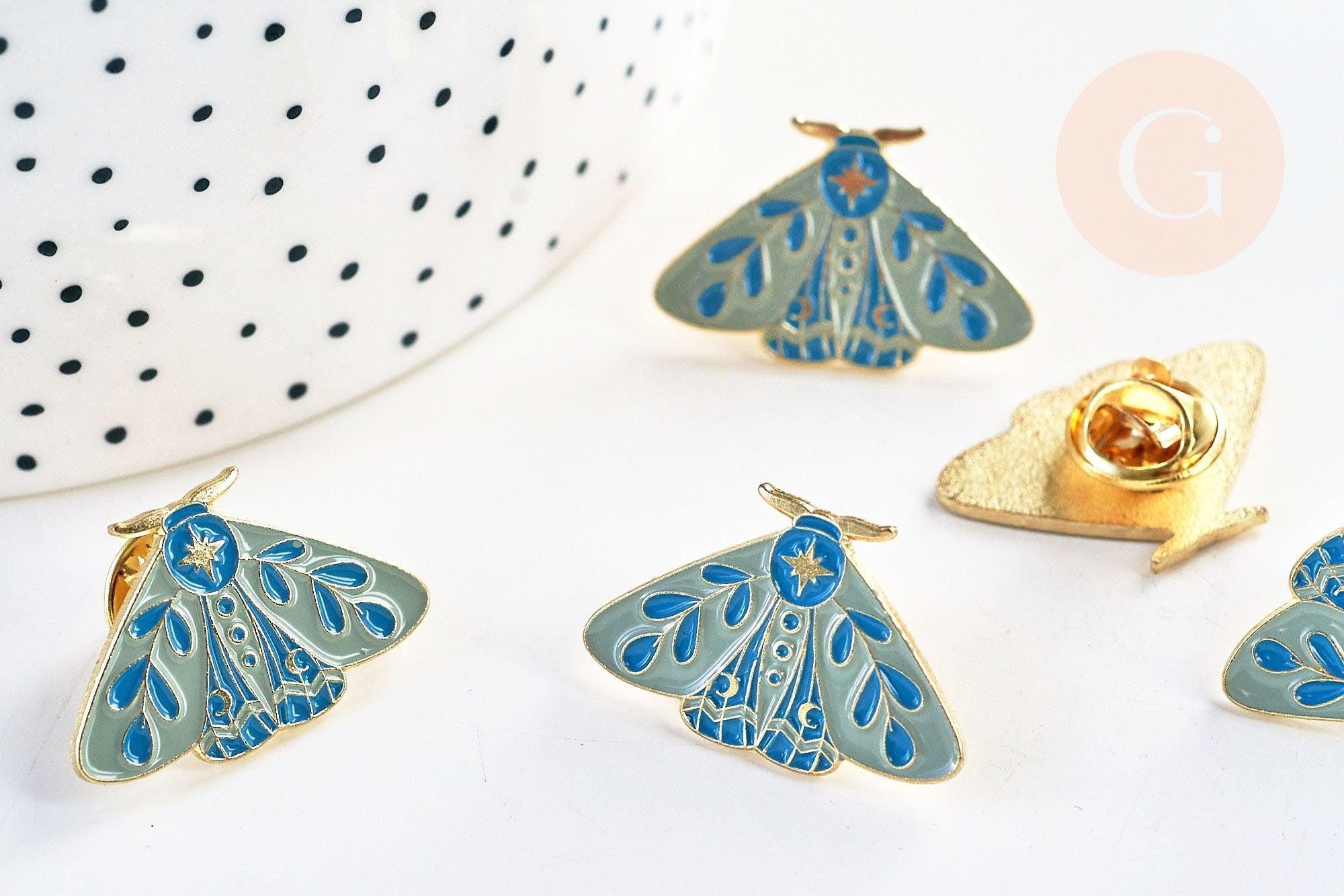 Broche pins papillon mystique doré émail bleu 27.5x18mm, x1 (G5547)