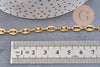 Chaine acier inoxydable doré IP 18k maille grain de café 7x4mm, x1 mètre (G5499)