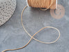 Cordon doré clair tressé polyester 0.8mm, x1 mètre (G5706)