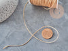 Cordon doré clair tressé polyester 0.8mm, x1 mètre (G5706)