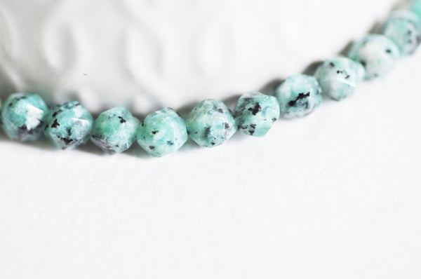 EP -Perles jaspe sésame facettes 6mm, x1 fil G2496