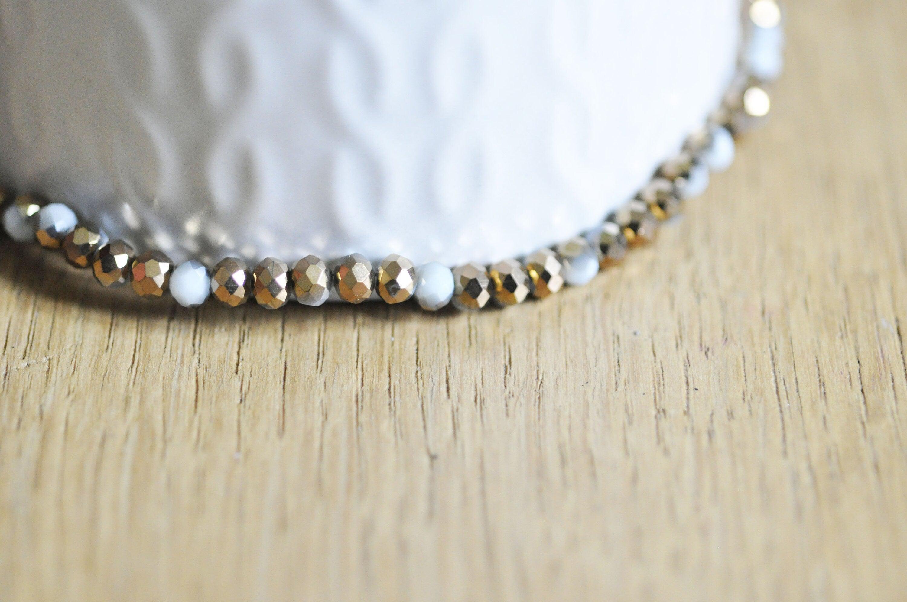 EP Perles toupies cristal blanc doré 4x3mm, x1 fil de 120