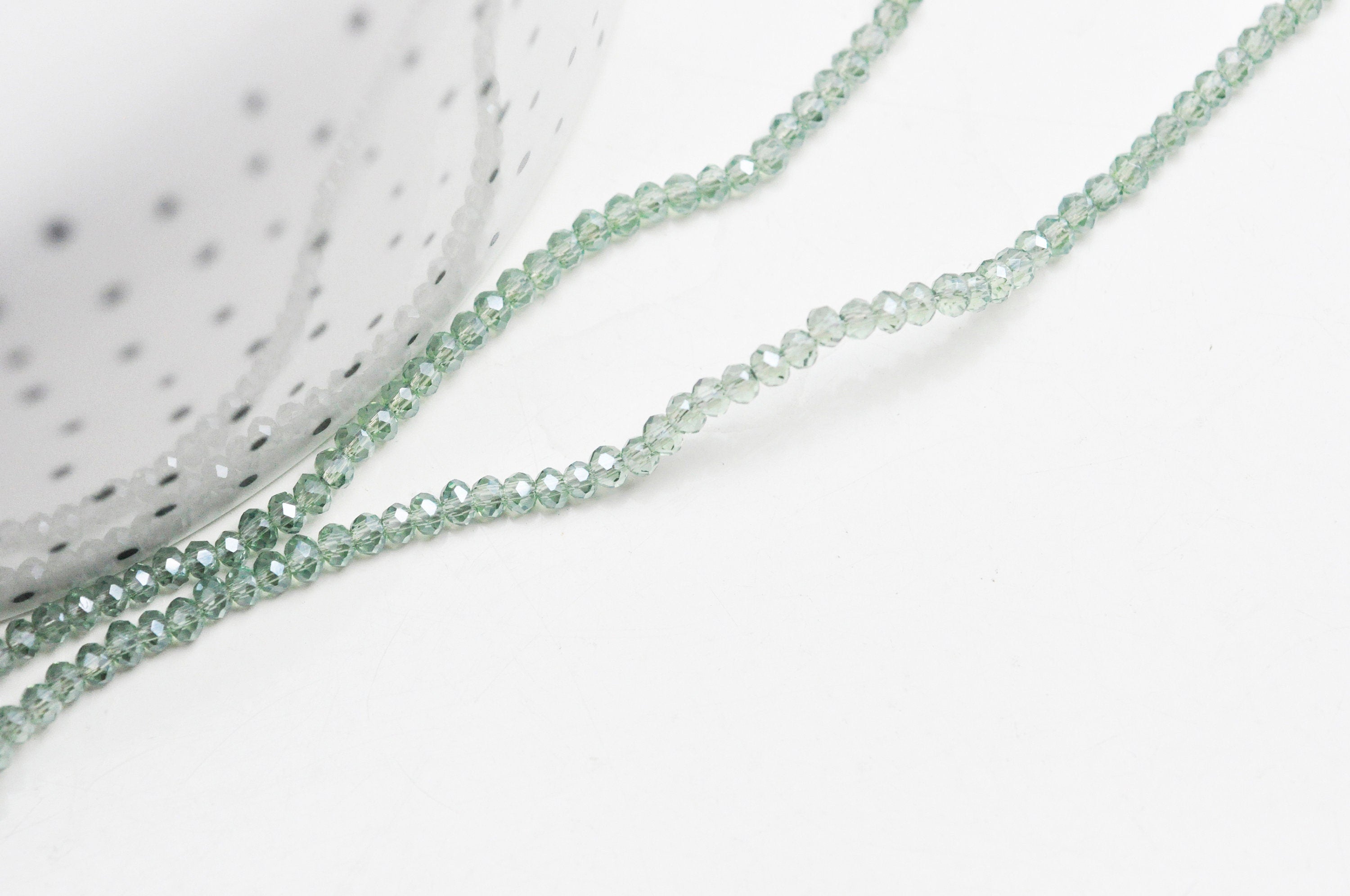 EP-Perles toupies cristal vert irisé facette 2.5mm, fil de 40cm G4435