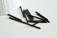 Grandes perles rocaille Tube noir 20x2.5mm, x 10gr (G3155)