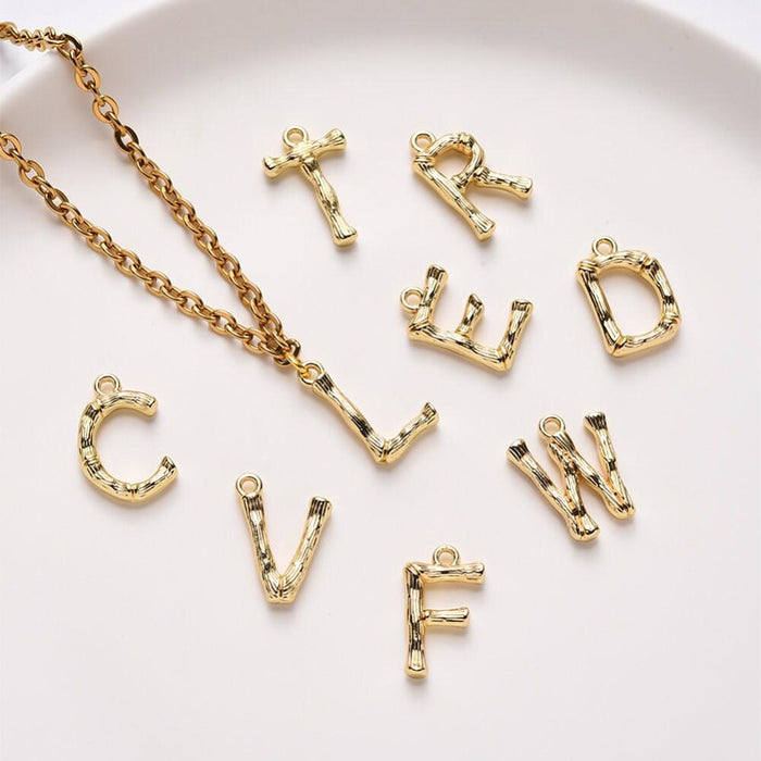 Pendentif lettre bambou zamac doré 18k 14-18mm, x1 (G4810)