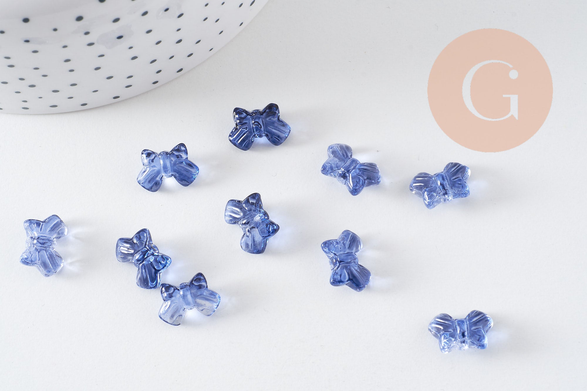 Perle noeud papillon verre bleu transparent irisé 9.5mm, x10 (G10597)