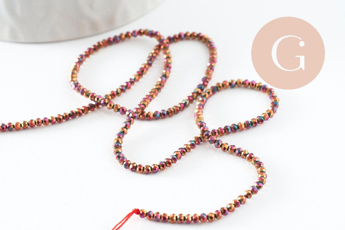 Perle ronde verre facettée multicolore pourpre irisée 2mm, x1 fil de 35cm (G7456)