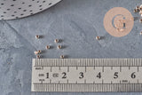 Petites perles à écraser en laiton or rose 2x1.2mm, avec règle de mesure.