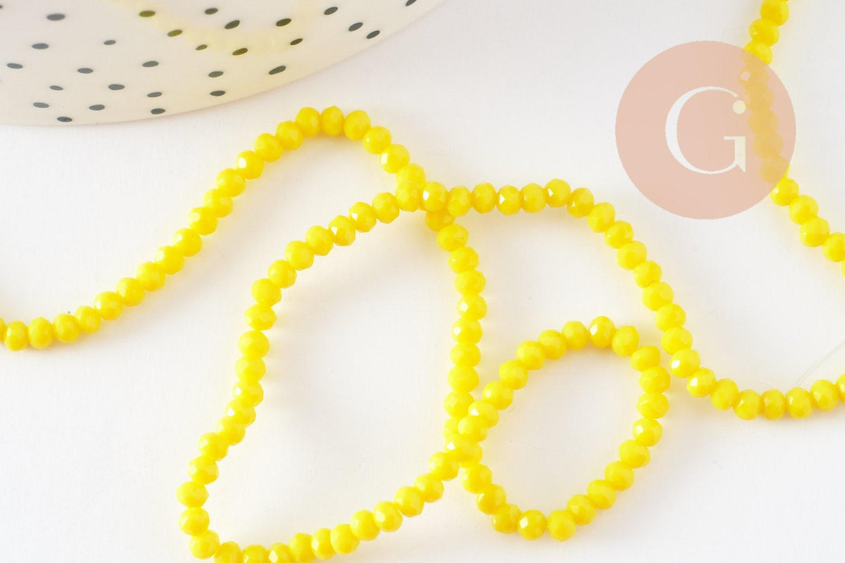 Perles rondelles verre jaune opaque facette 3x2mm, x1 fil de 32cm (G8256)