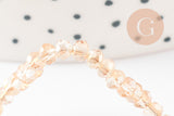 Perles toupies cristal orange transparent irisé 3.5x2.5mm, x1 fil 25cm (G8595)